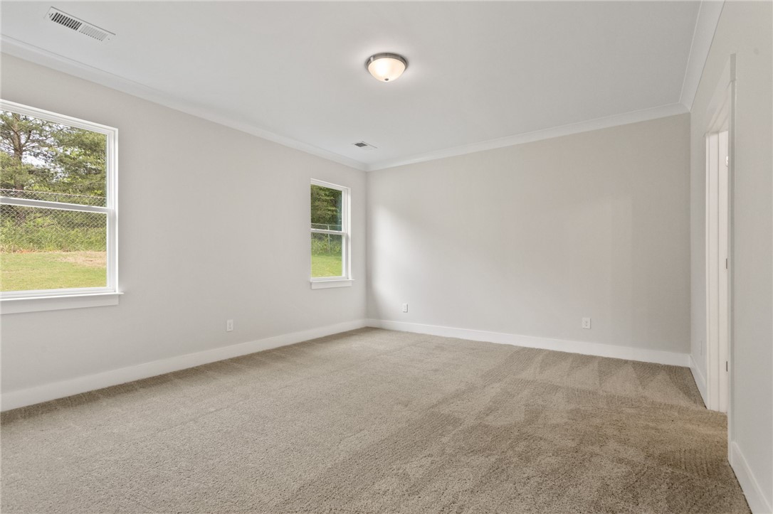 315 Old Shirley Road Central, SC 29630 - Photo 16 of 26 This spacious room features ample natural light and plush carpeting, ready for your personal touch.