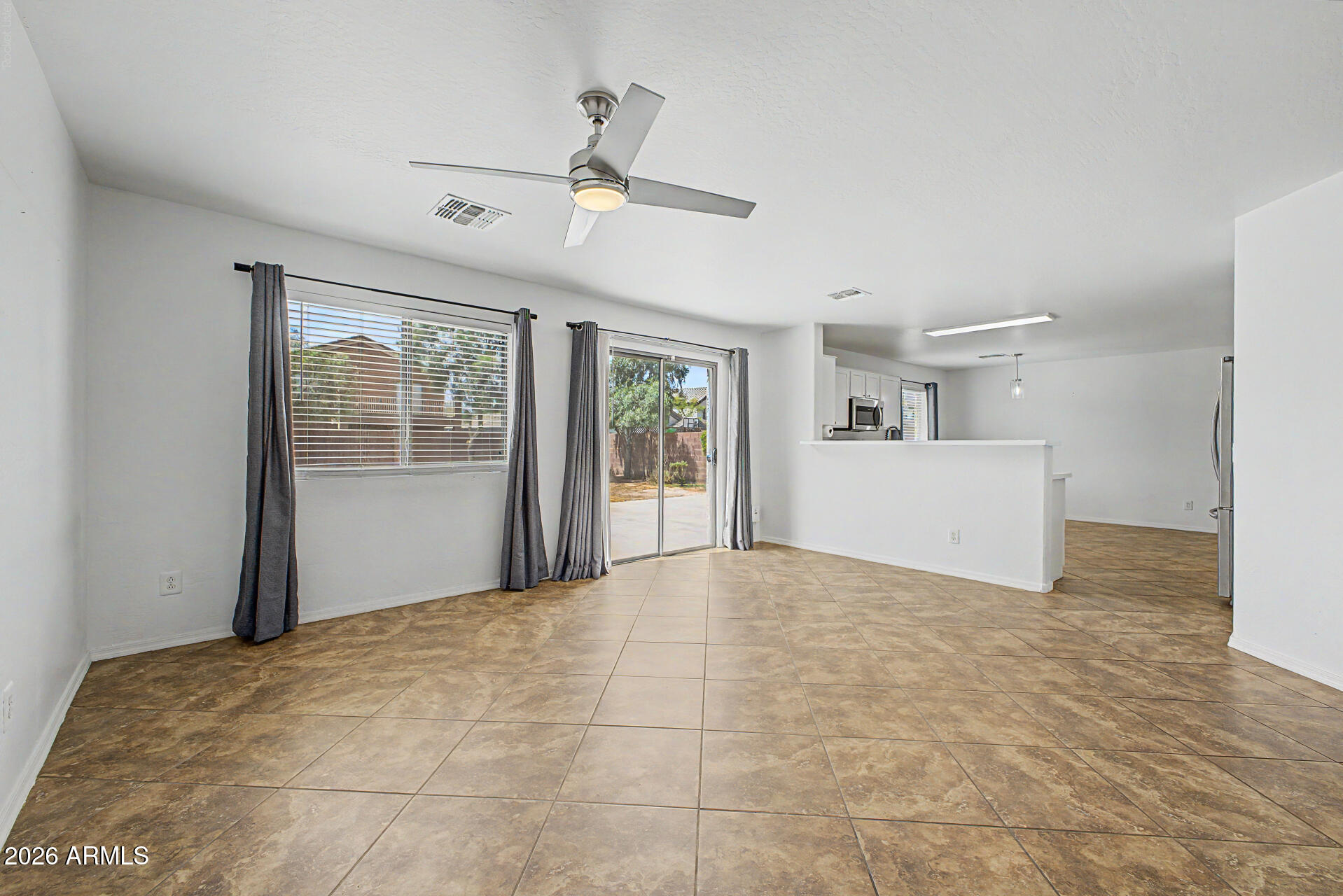 8337 West Payson Road Tolleson, AZ 85353 - Photo 13 of 44 Familyroom and door to backyard