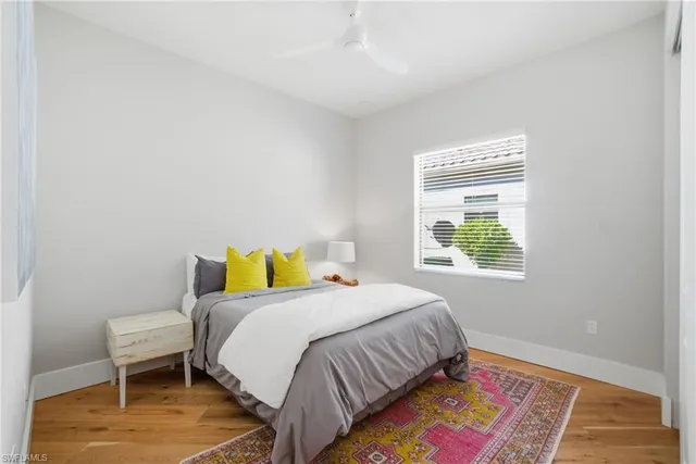 a living room with furniture fireplace and window