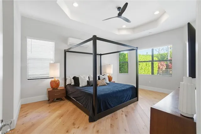 a room with stainless steel appliances furniture a chandelier and kitchen view