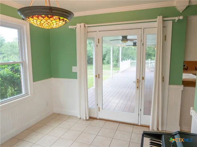a view of an entryway with wooden floor and a window