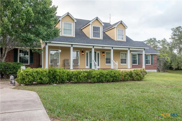 front view of a house next to a yard