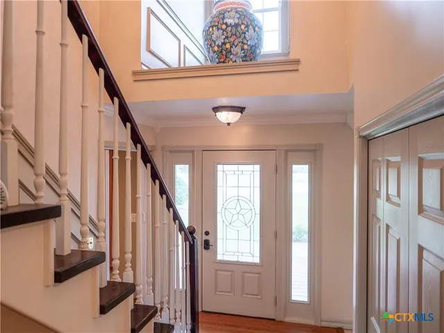 a view of front door with stairs