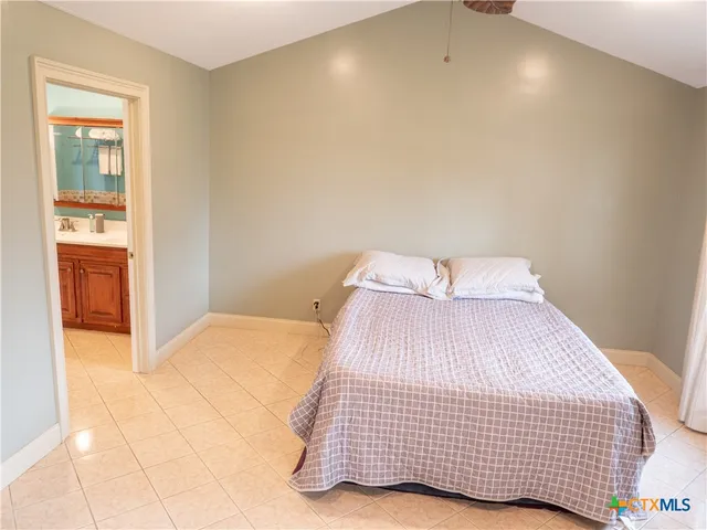 a bedroom with a bed and closet