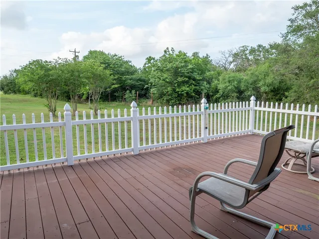 a view of a porch with wooden floor and outdoor space