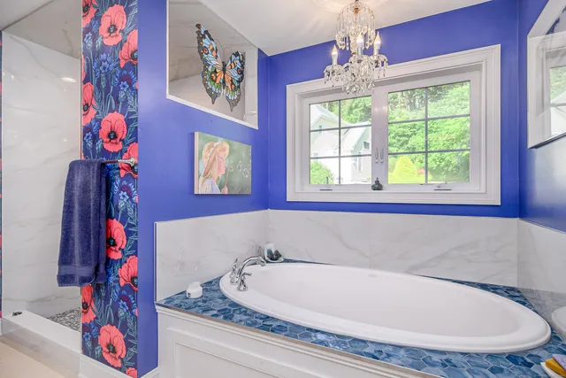 a bath tub sitting next to a window