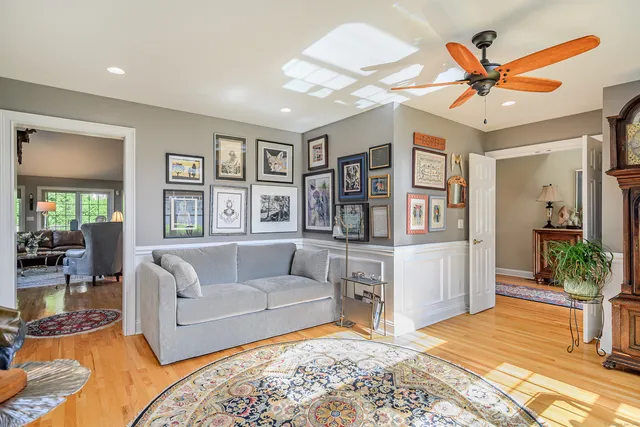 a living room with furniture and a rug