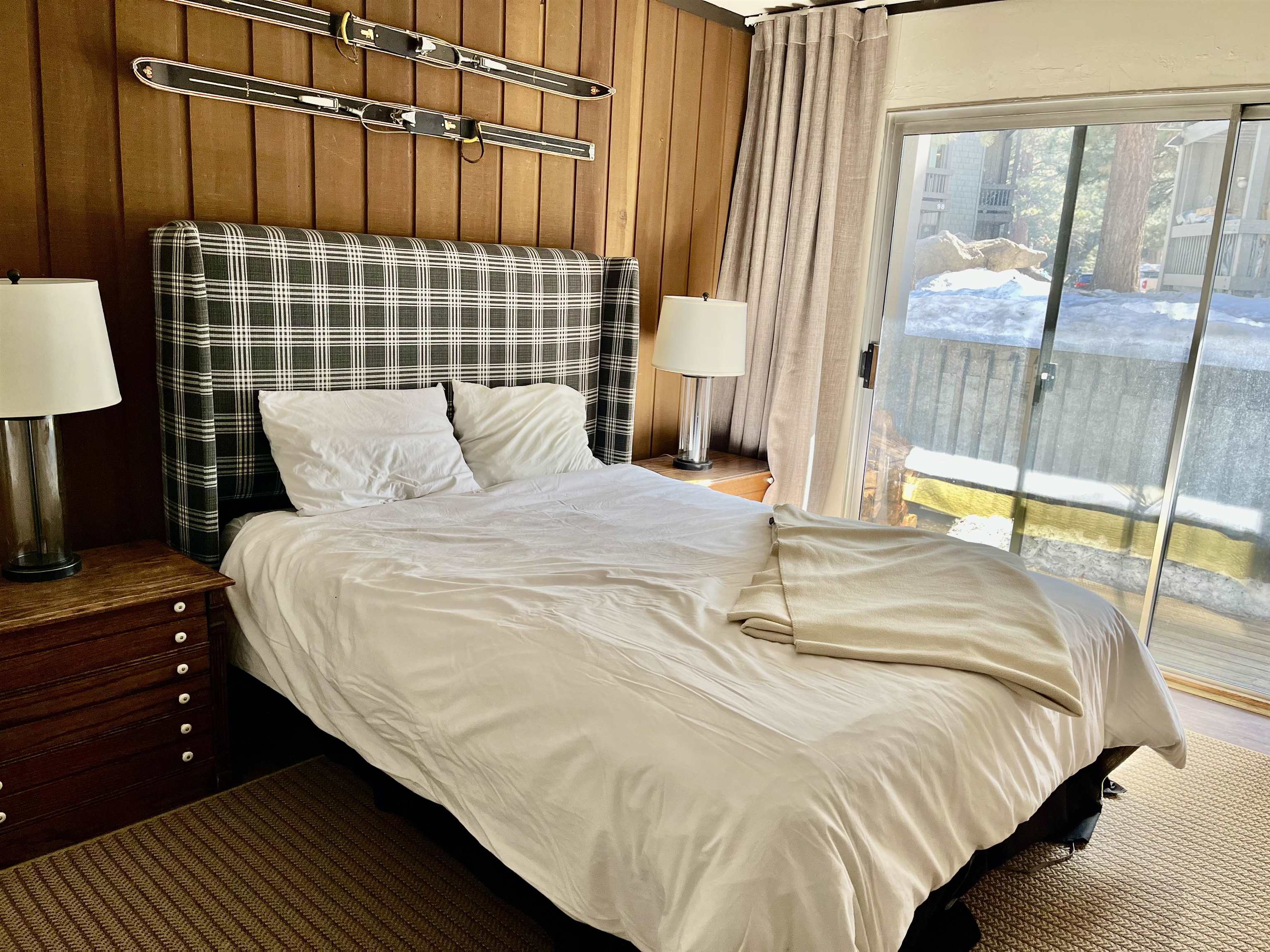 286 Old Mammoth Road, Unit 7 Mammoth Lakes, CA 93546 - Photo 17 of 31 a bedroom with a bed and wooden floor