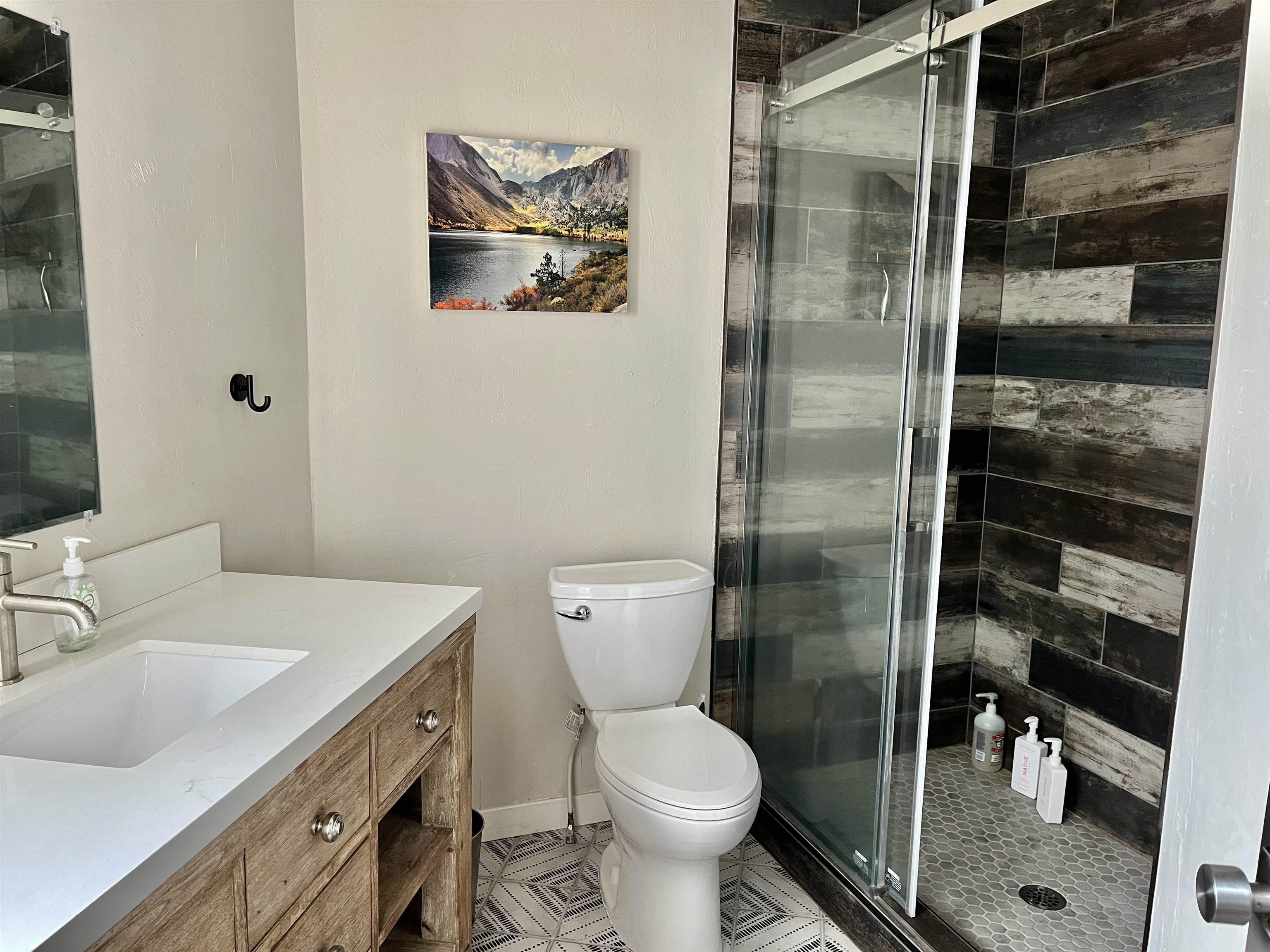 286 Old Mammoth Road, Unit 7 Mammoth Lakes, CA 93546 - Photo 18 of 31 a bathroom with a toilet sink and shower