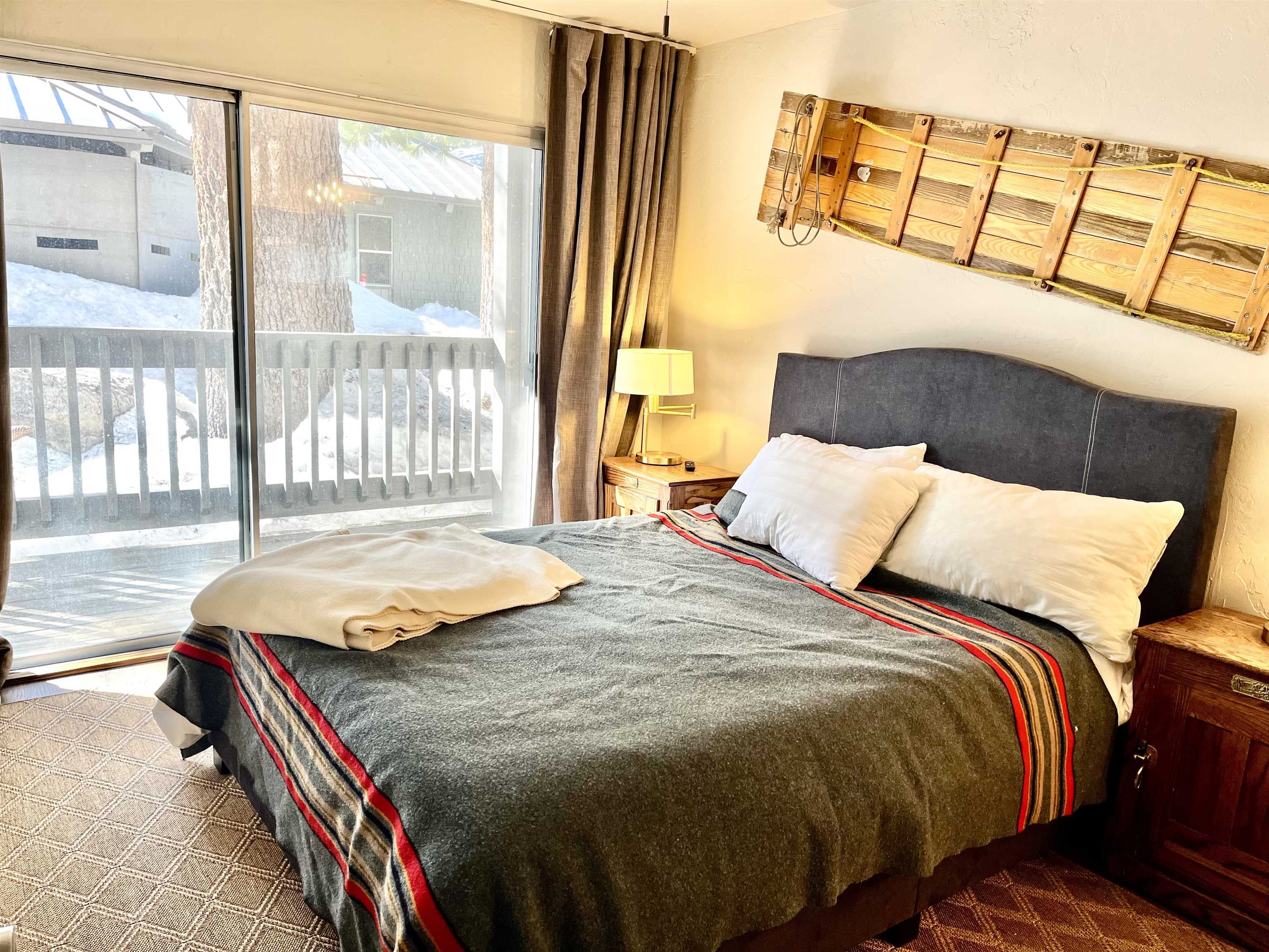 286 Old Mammoth Road, Unit 7 Mammoth Lakes, CA 93546 - Photo 20 of 31 a bed sitting in a bedroom next to a window