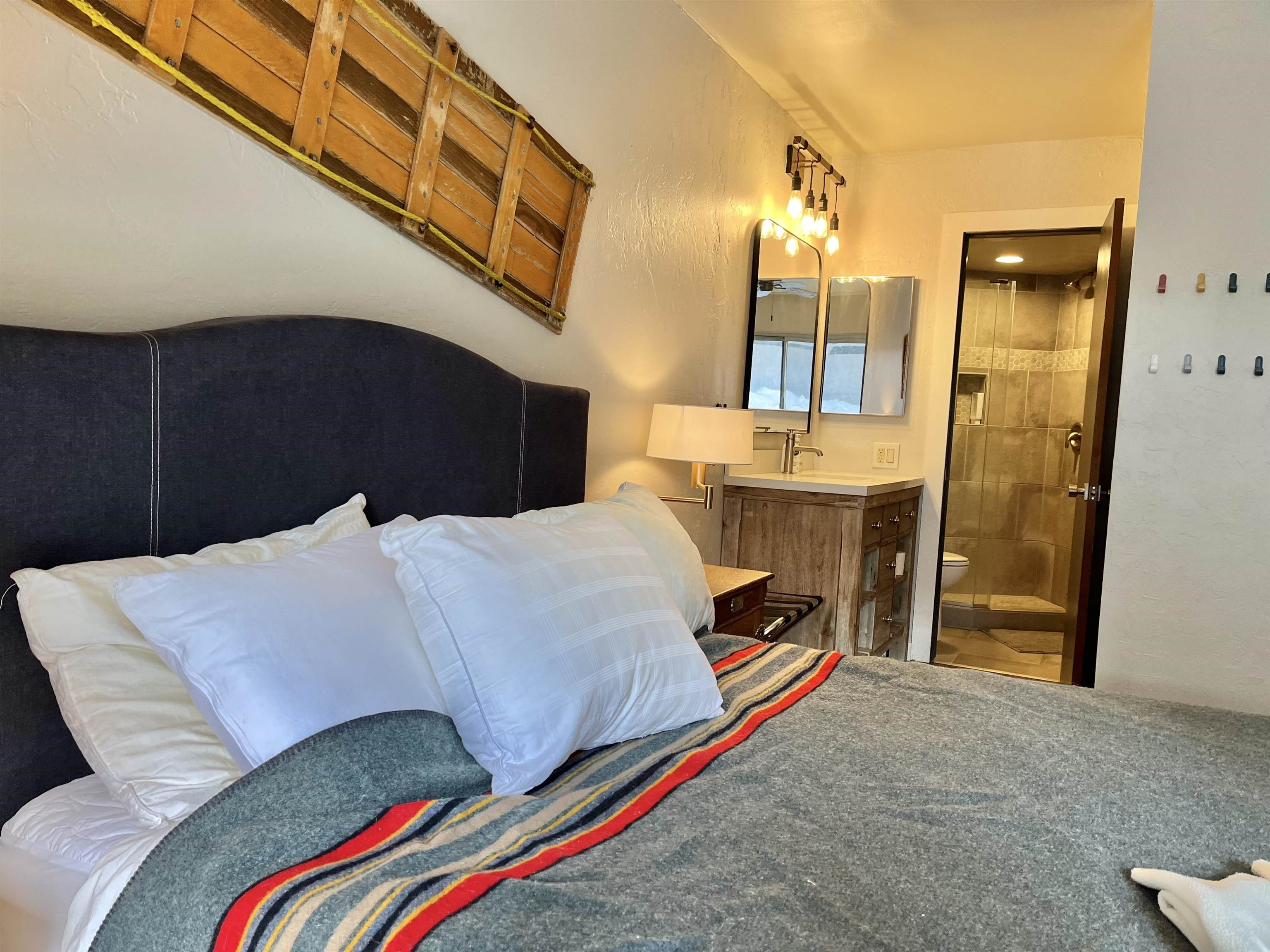 286 Old Mammoth Road, Unit 7 Mammoth Lakes, CA 93546 - Photo 22 of 31 a bed room with a bed and a mirror