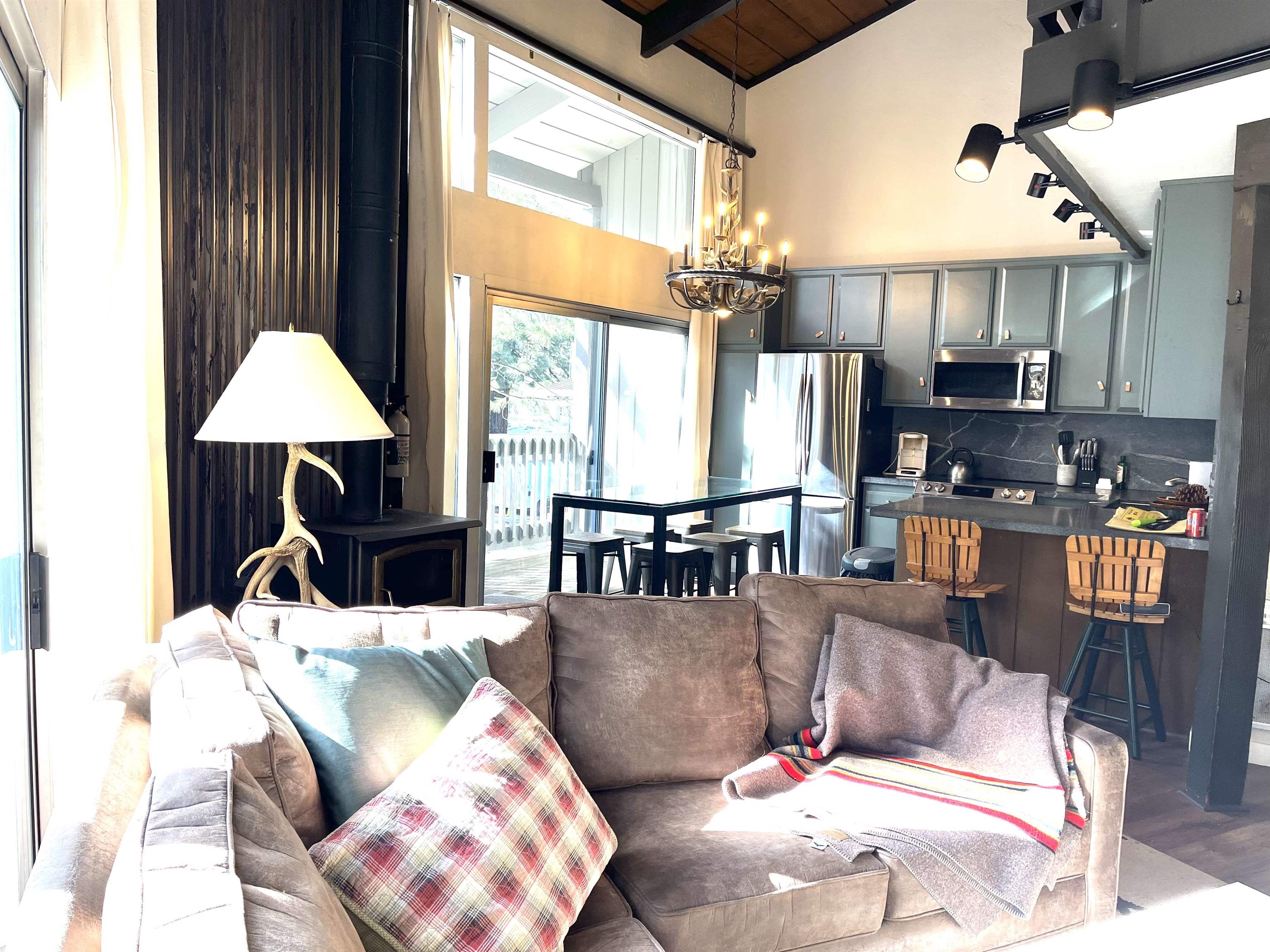 286 Old Mammoth Road, Unit 7 Mammoth Lakes, CA 93546 - Photo 7 of 31 a living room with furniture and a chandelier