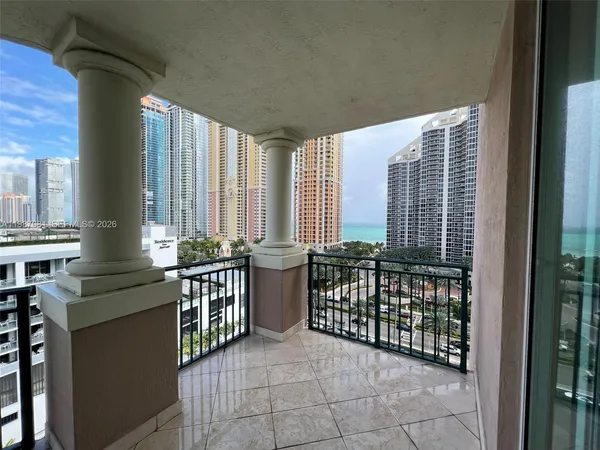 a view of a balcony and chairs