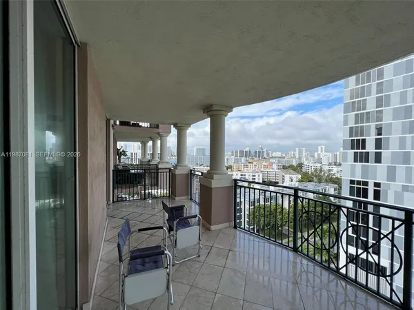 a view of a balcony with chairs