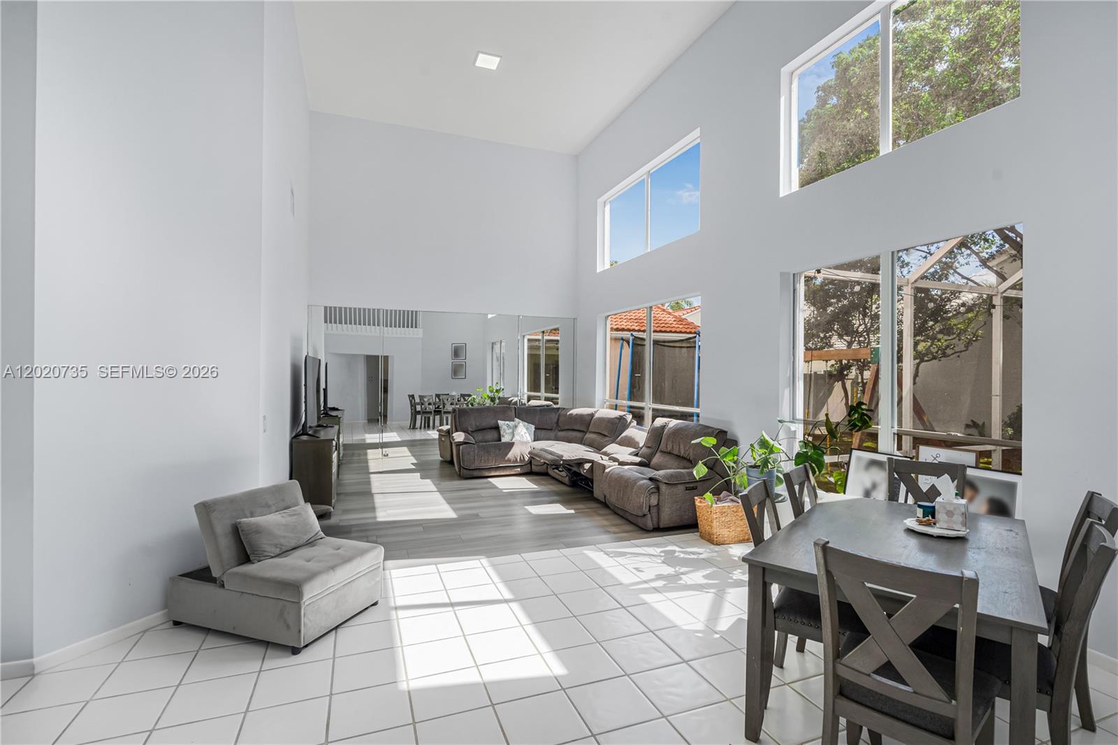 17244 Balboa Point Way Boca Raton, FL 33487 - Photo 6 of 66 a living room with furniture and a flat screen tv