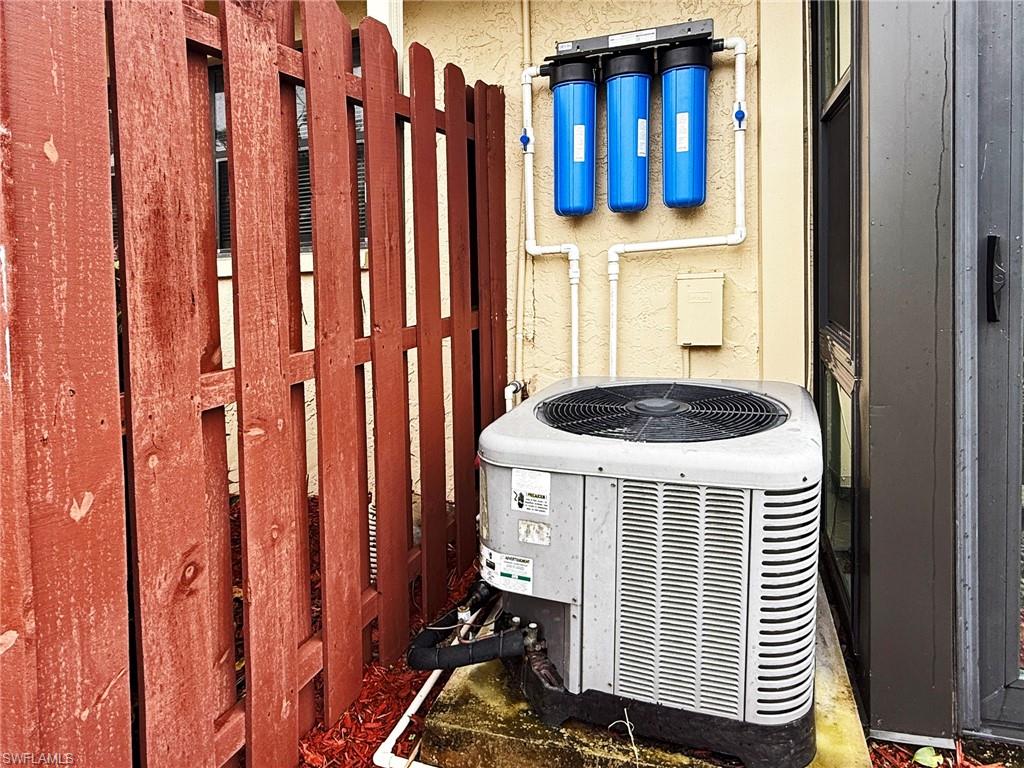 2005 Pine Isle Lane, Unit 2005 Naples, FL 34112 - Photo 15 of 23 Exterior view of newer cooling unit and water treatment system.