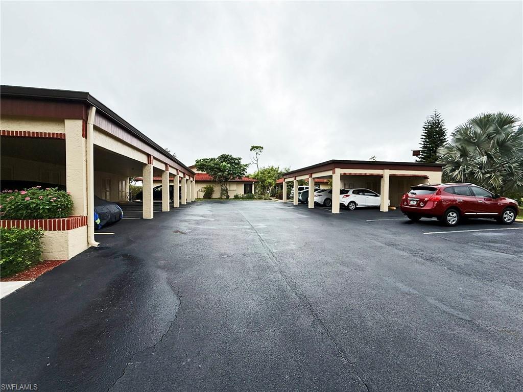 2005 Pine Isle Lane, Unit 2005 Naples, FL 34112 - Photo 17 of 23 View of covered parking lot