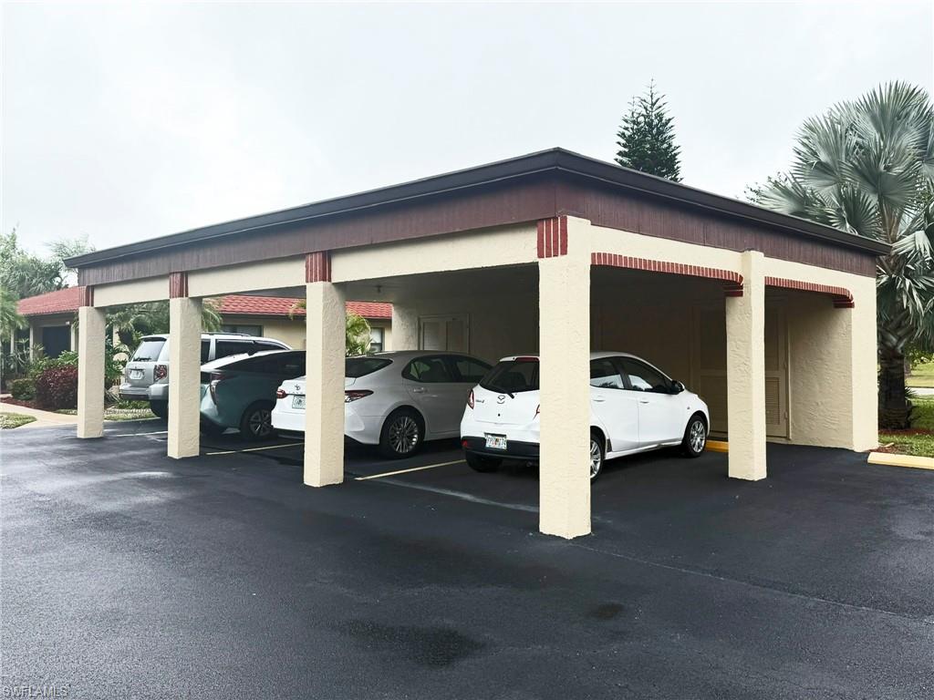 2005 Pine Isle Lane, Unit 2005 Naples, FL 34112 - Photo 18 of 23 View of covered parking lot, with assigned parking.