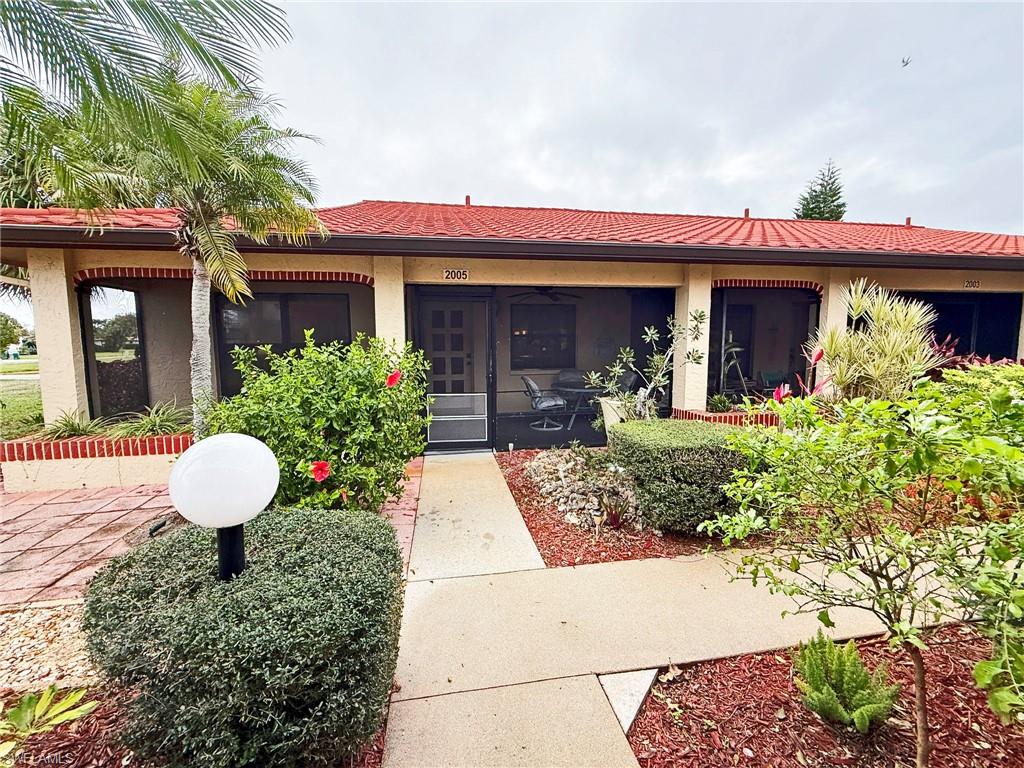 2005 Pine Isle Lane, Unit 2005 Naples, FL 34112 - Photo 2 of 23 Screened entryway.