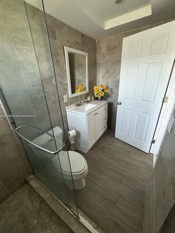 a room with table chairs and white walls