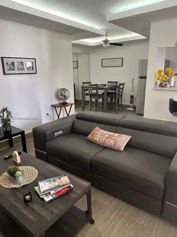 a living room with furniture and a table