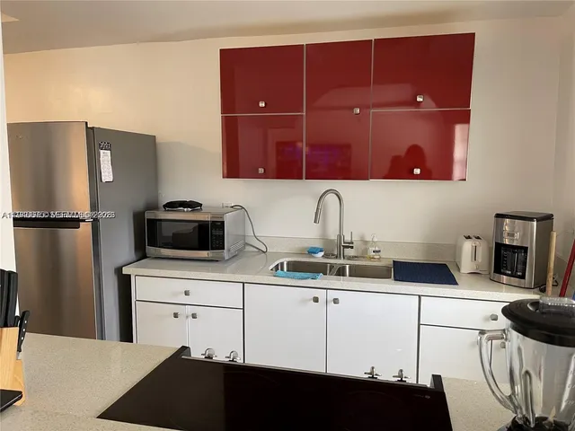 a kitchen with a sink and a cabinets