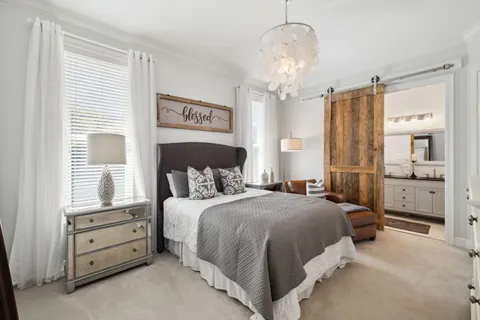 a bathroom with a double vanity sink mirror and toilet