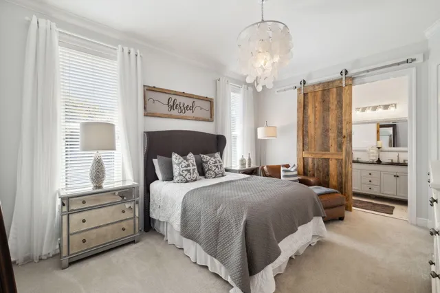 a bathroom with a double vanity sink mirror and toilet
