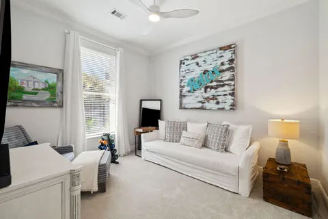 a view of a pathway of a house with wooden fence