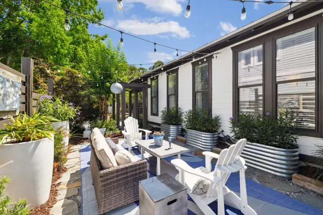 a view of a pathway with a garden