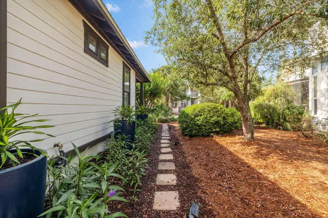 an aerial view of a house with garden space and street view