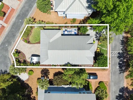 a front view of a house with a yard table and chairs