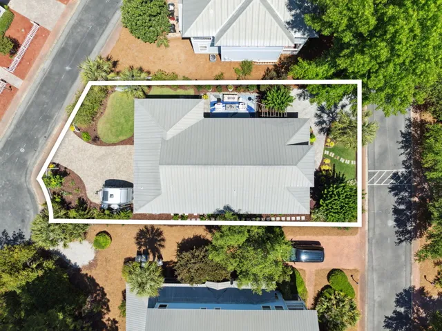 a front view of a house with a yard table and chairs