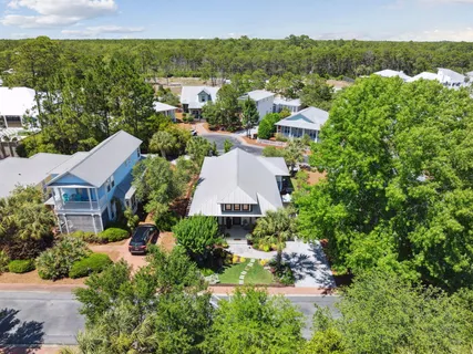 a swimming pool with outdoor seating and yard