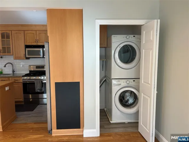 a view of a kitchen with washer and dryer