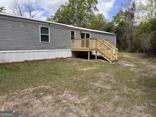 150 Back Street Metter, GA 30439 - Photo 20 of 21 a view of a house with a yard