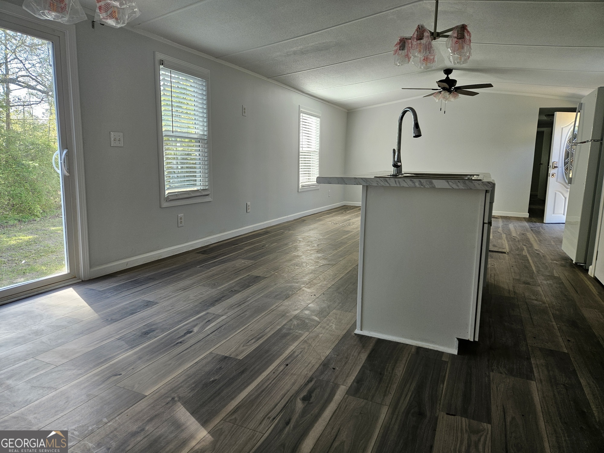 150 Back Street Metter, GA 30439 - Photo 3 of 21 wooden floor in an empty room with a window