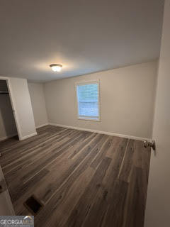 150 Back Street Metter, GA 30439 - Photo 9 of 21 an empty room with wooden floor and windows