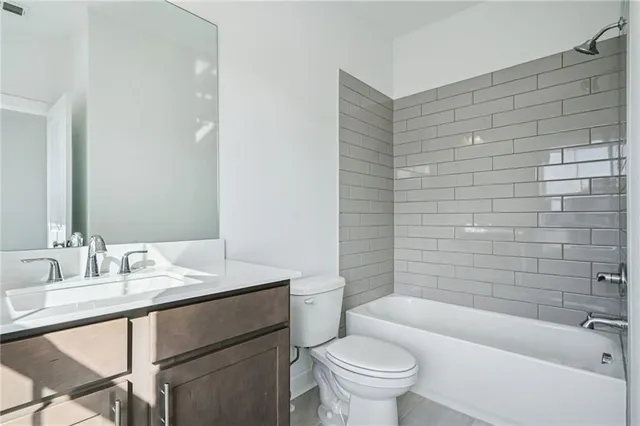 a bathroom with a sink a toilet and bathtub