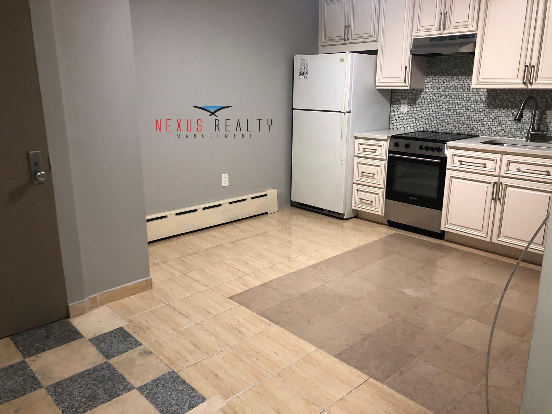 19-22 21st Road, Unit BSMT Queens, NY 11105 - Photo 4 of 10