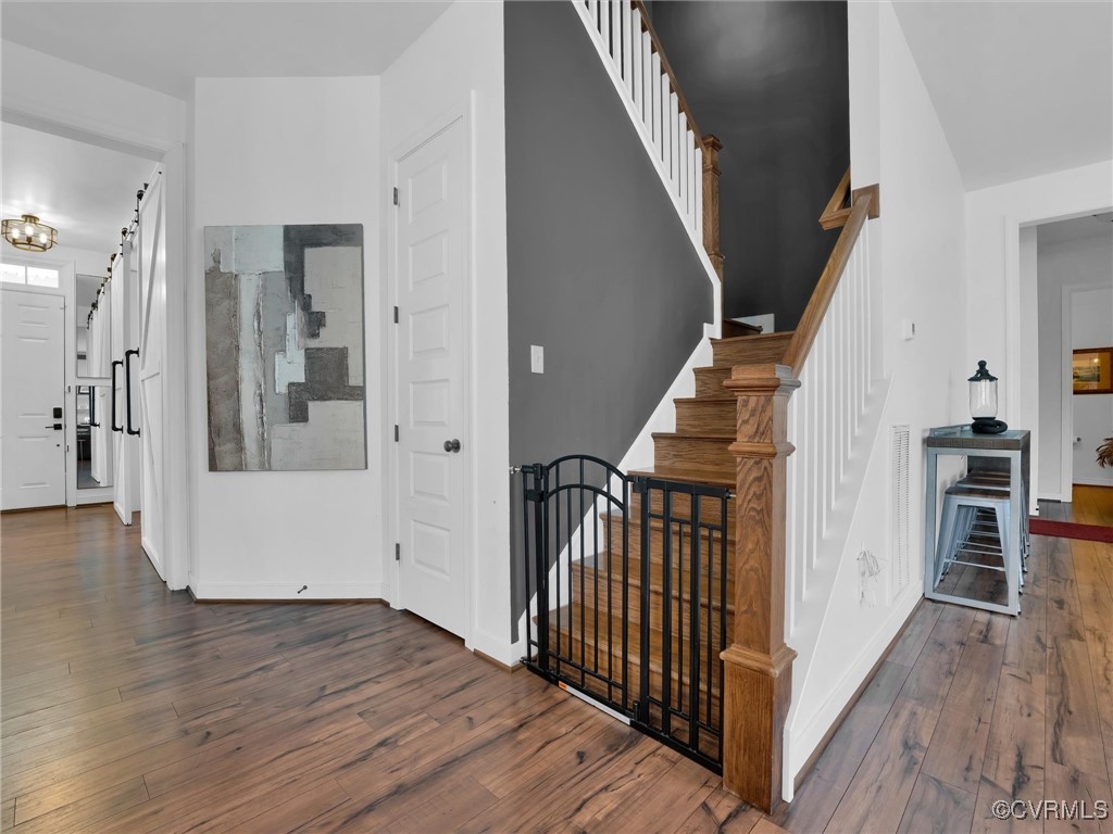 15324 Sultree Drive Midlothian, VA 23112 - Photo 21 of 48 a view of a hallway with wooden floor and stairs