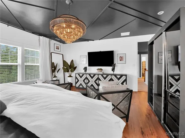 a view of a livingroom with furniture and a flat screen tv