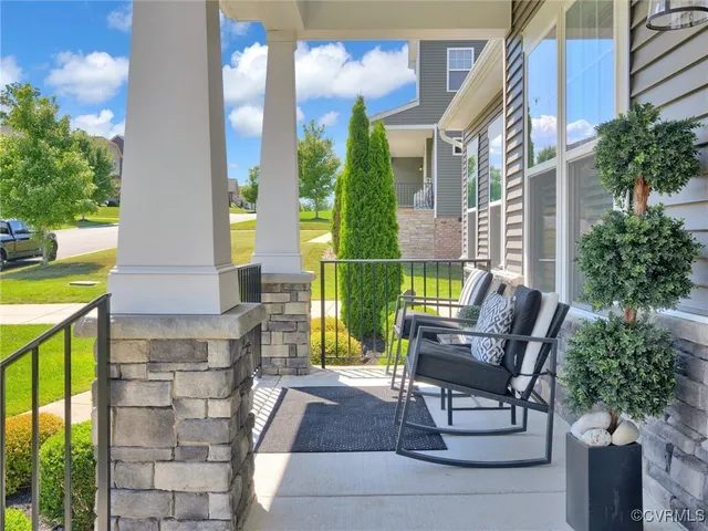 a front view of a house with outdoor seating