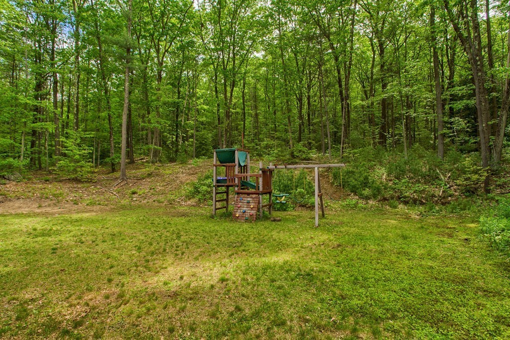 2270 South Athol Road Athol, MA 01331 - Photo 29 of 30 a backyard of a house with table and chairs