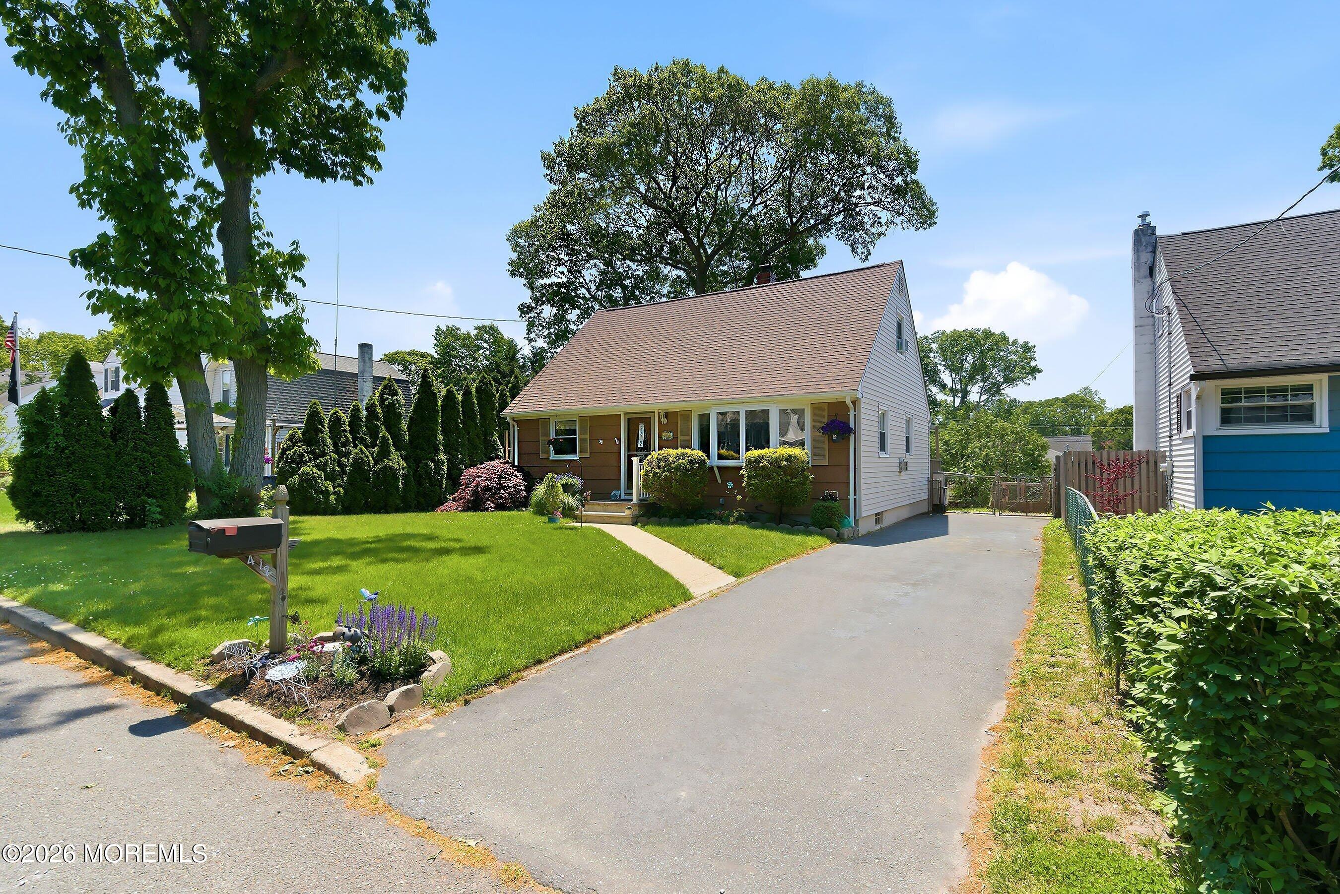 412 Moore Road Neptune Township, NJ 07753 - Photo 2 of 36 a front view of house with yard and green space