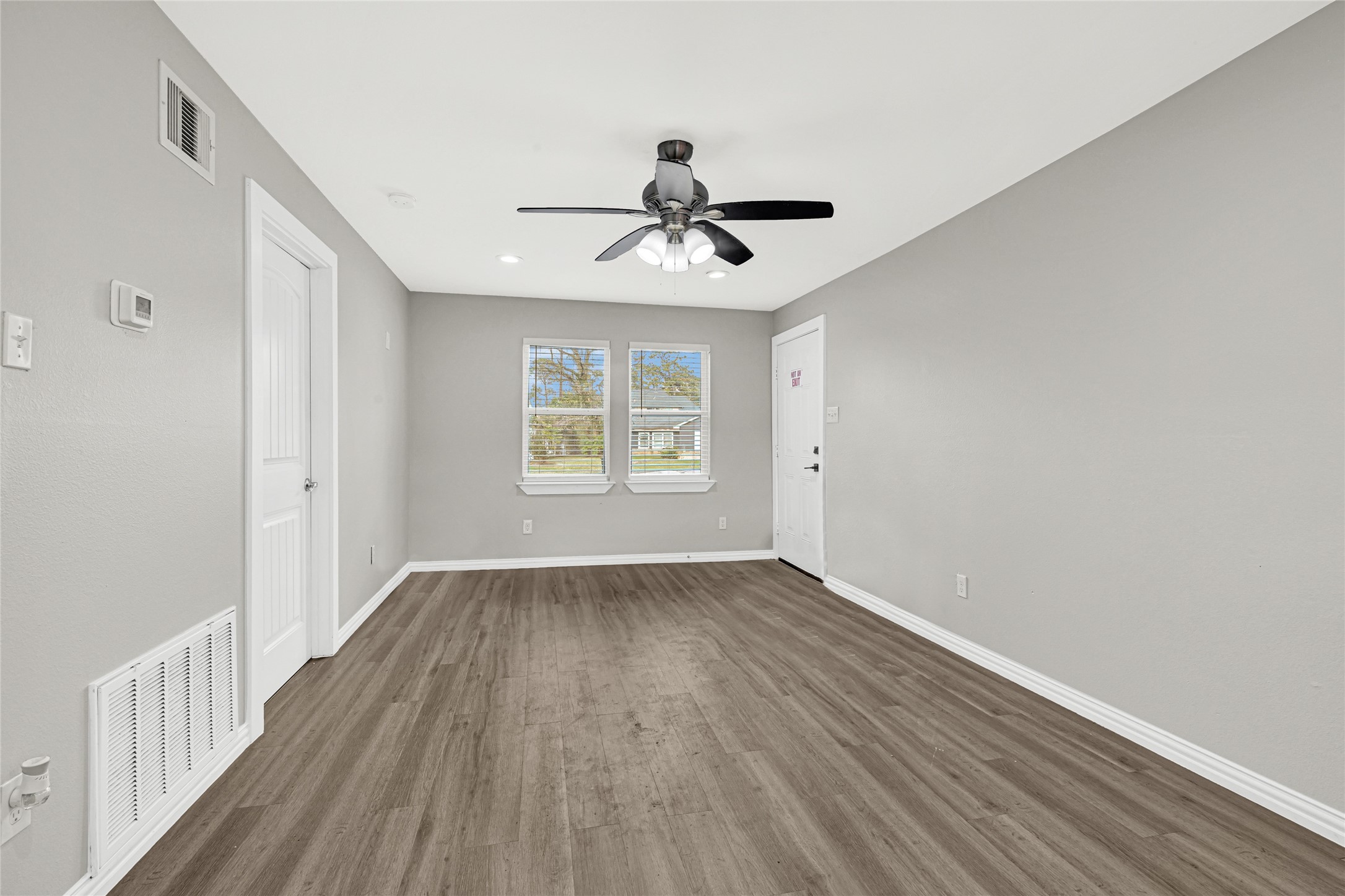 4322 Alconbury Lane, Unit 1 Houston, TX 77021 - Photo 17 of 30 wooden floor in an empty room with a window