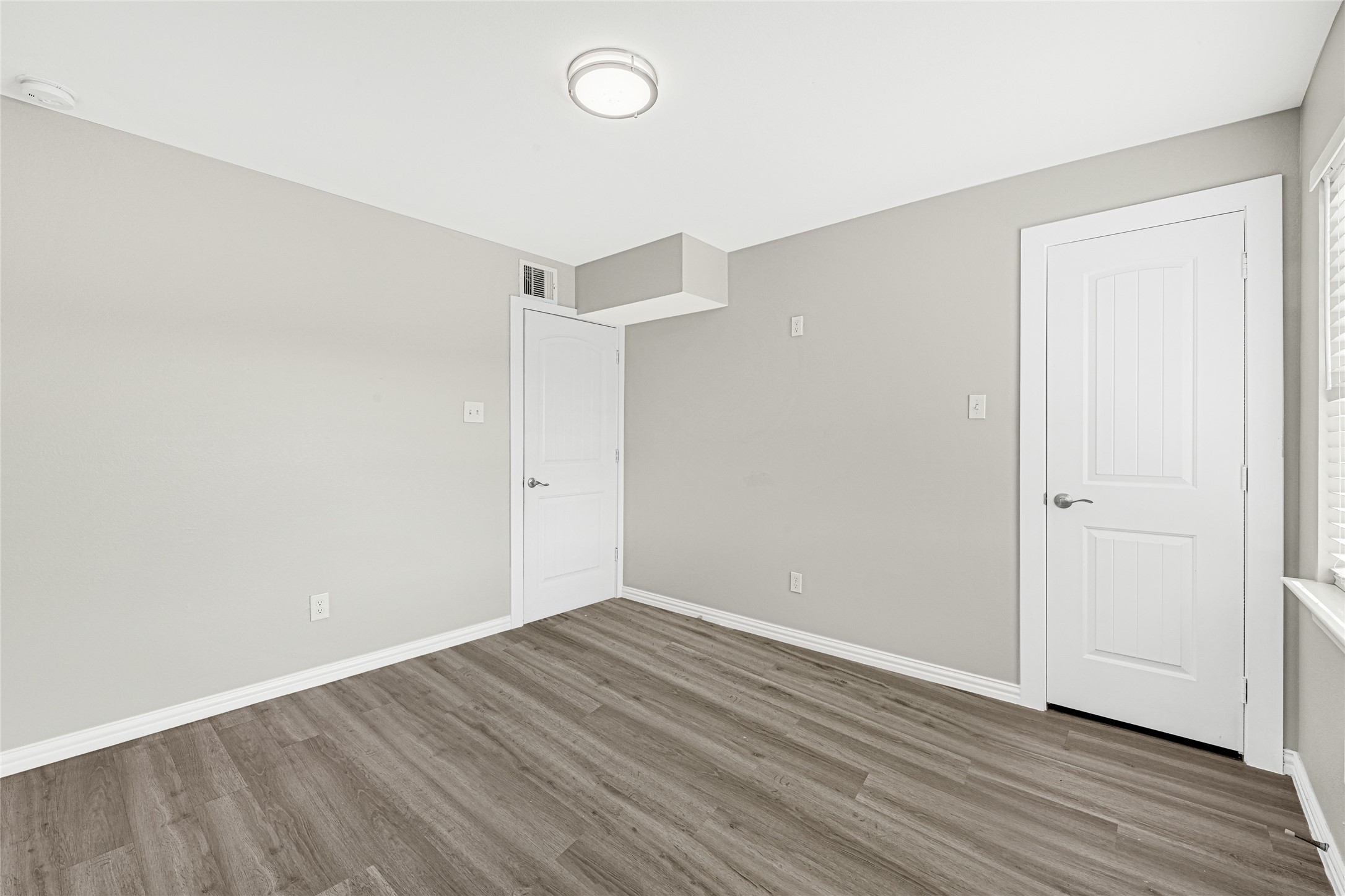 4322 Alconbury Lane, Unit 1 Houston, TX 77021 - Photo 23 of 30 a view of an empty room with wooden floor