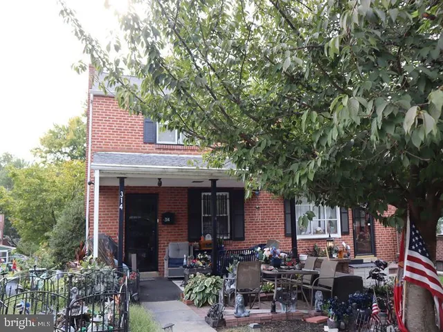 a view of a patio with table and chairs and potted plants