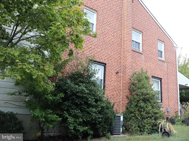 a view of a house with a tree