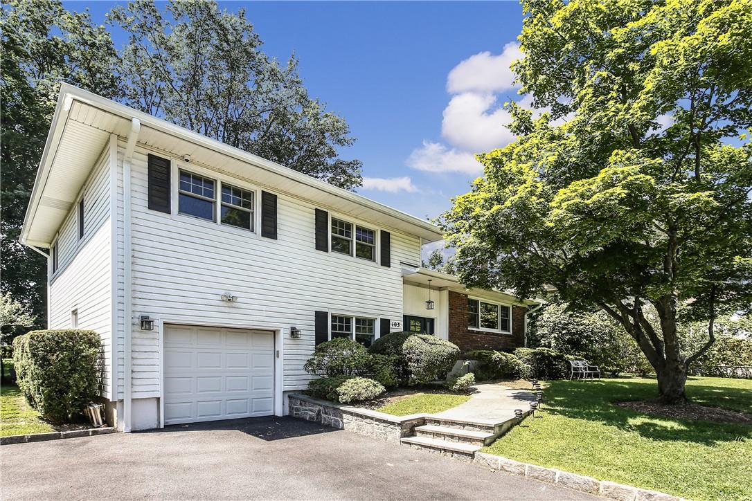 103 Harvard Road New Rochelle, NY 10804 - Photo 1 of 1 a front view of a house with a yard and garage